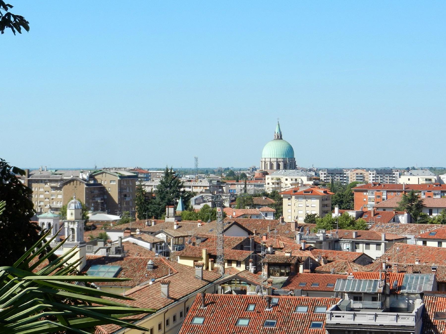 Rooftops of Udine with the Tempio Ossario dome